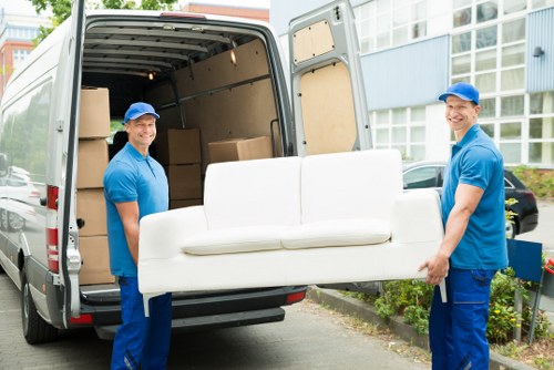 Man with van loading items for a UK moving service