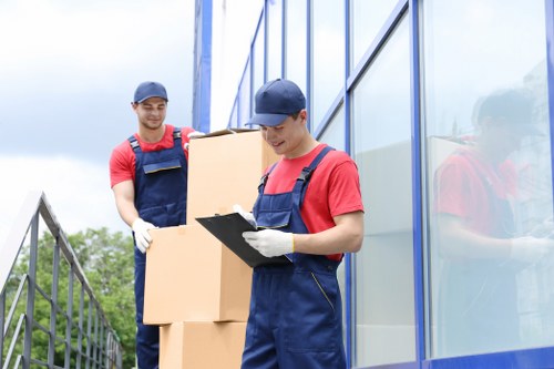 Business and home items being moved by a Bow man with a van