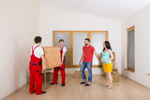 Packers handling household items for a Bow move
