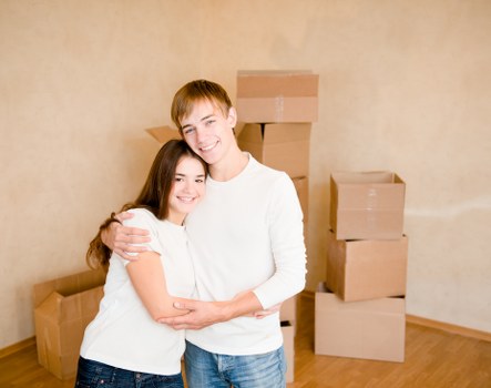 Loading furniture into a moving van in Bow