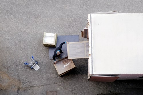 Removal van loading household furniture and boxes in Bow