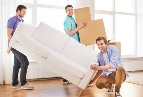 Commercial movers transporting office furniture for a Bow business move