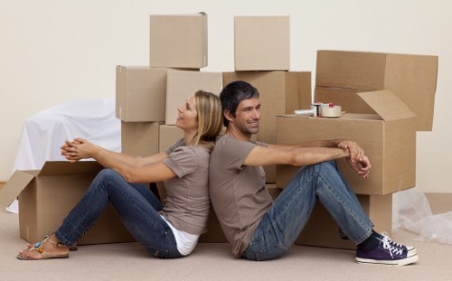Desk, boxes, and office supplies ready for commercial relocation