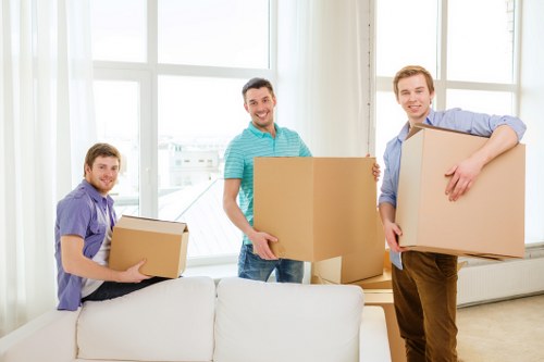 Loading household furniture into a removal truck in East London
