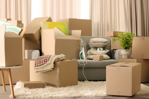 Local Bow movers unloading furniture at a flat and preparing items for placement