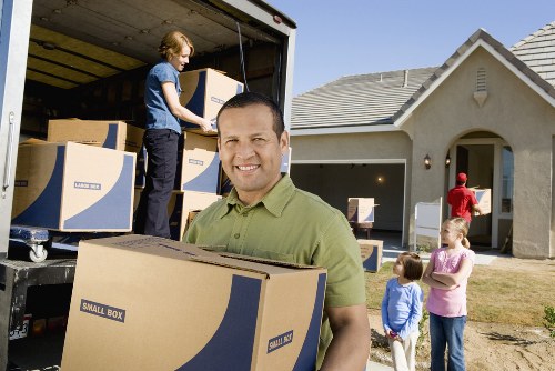 Professional office removals team handling equipment in Bow